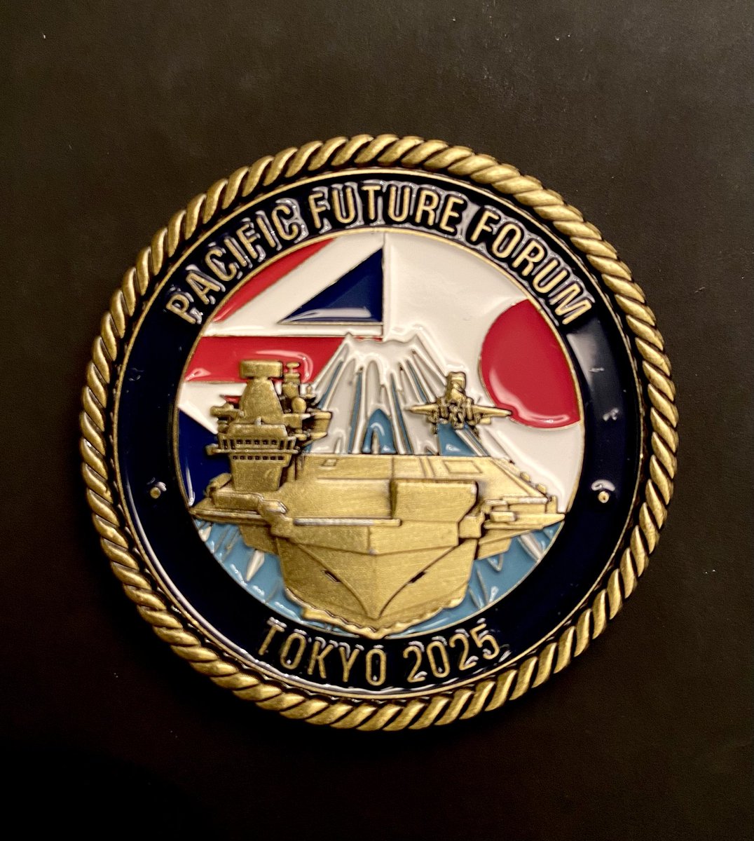 If you collect ‘Challenge Coins’, this is a special one. Presented to the 450 delegates who attended PFF25 last week <a href="/FutureAtlantic/">Atlantic and Pacific Future Forum</a> in Tokyo onboard HMS Prince of Wales, it depicts the carrier, with F35B against a backdrop of Mt Fuji. Add to your collection! <a href="/RoyalNavy/">Royal Navy</a>