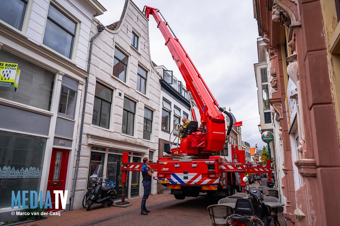 Brand in woning boven winkel in Schiedam