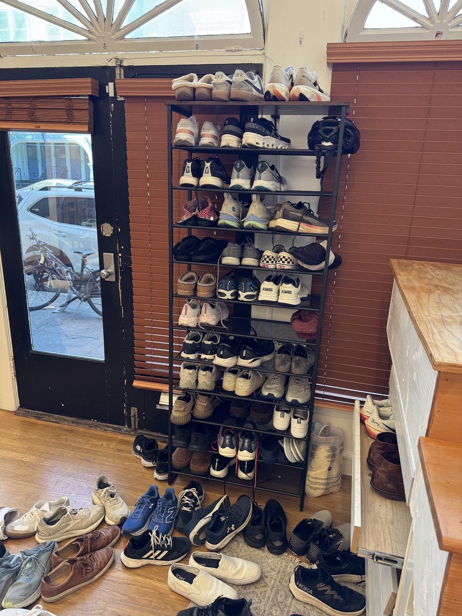 benln's tweet image. Cursor office got a shoe rack upgrade