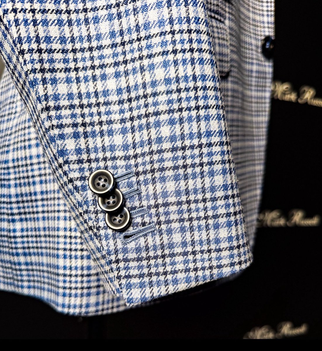 Swap the standard navy blazer for a blue check jacket to stand out with subtle sophistication.