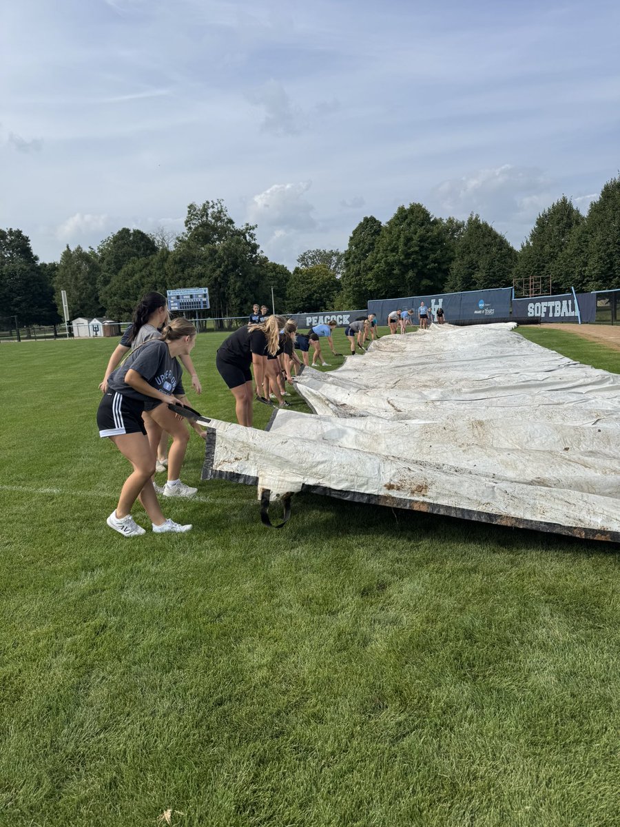 Peacocks put their brains to the test, then their backs to work. Trivia + tarps = a winning combo 🦚🧩💪 #PeacockOlympics #UIUSoftball