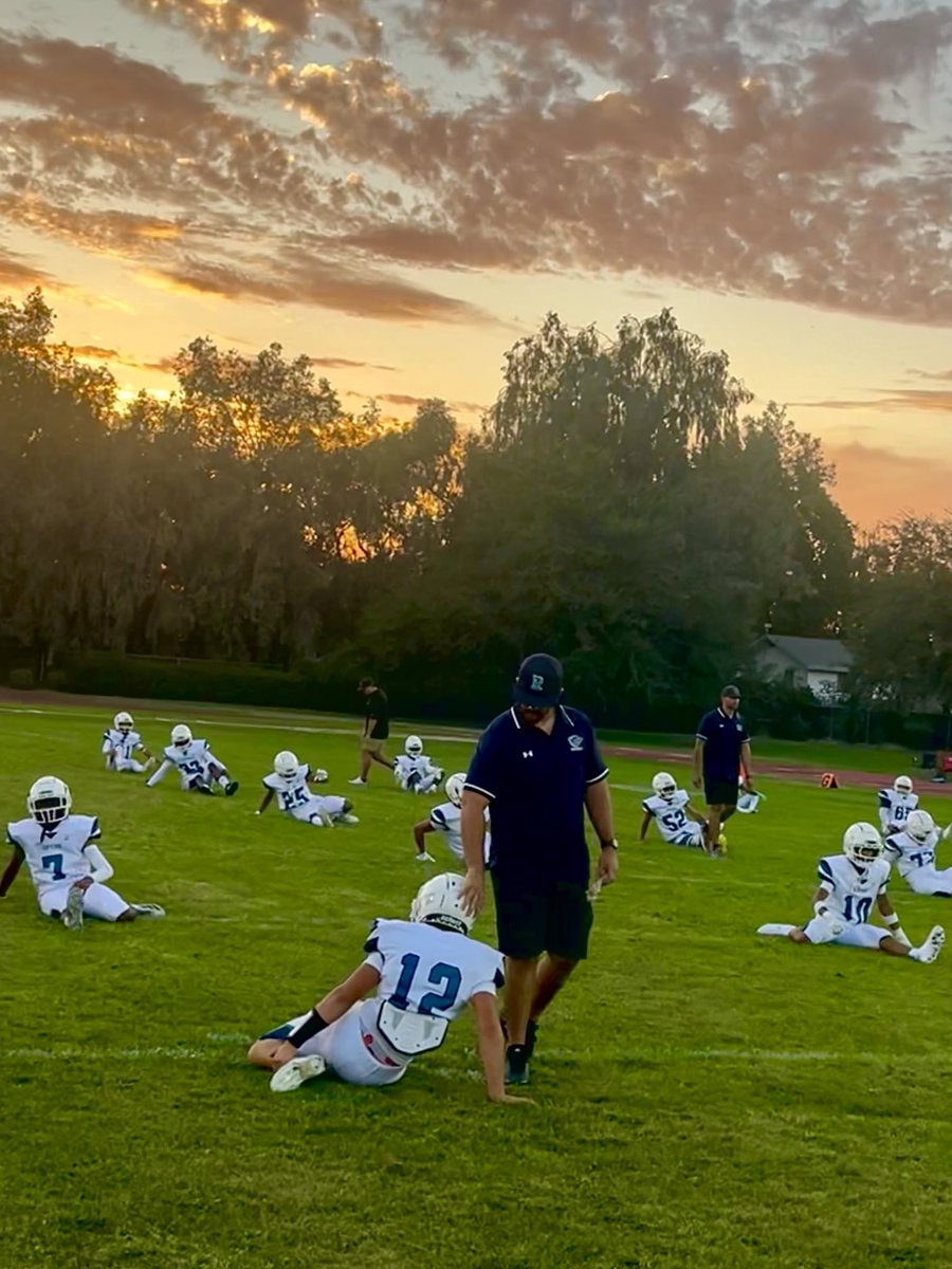 River Islands Head Coach Nick Hardenbrook dabs starting QB Carpenter as the Rip Tide hit their pre-game stretches at Waterford