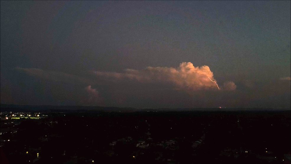 Weak storm 40-50 miles away with a visible bolt-from-the-blue CG flash. Huntsville, AL, 7:45 PM local time.