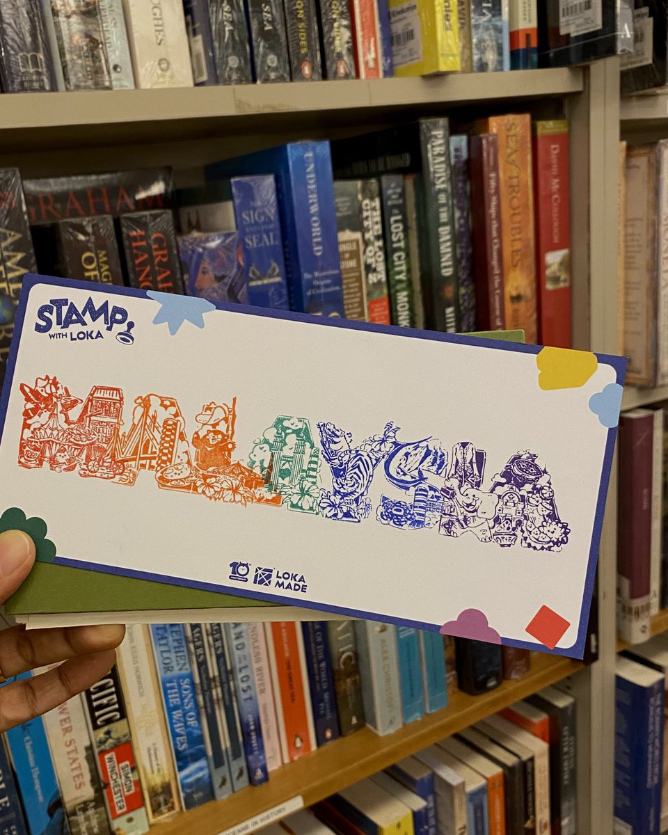 at Kino browsing books + stamp hunt for the Malaysia-themed stamps by The Loka Made
