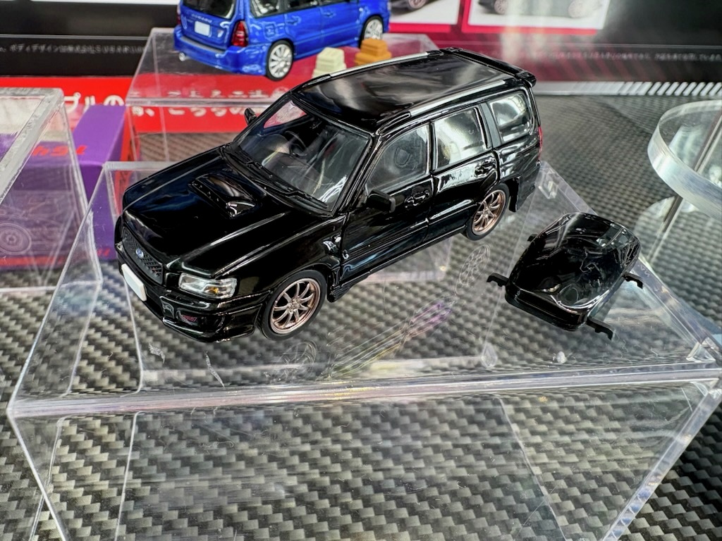 joshin_skl's tweet image. ホビージャパンが展開する新ブランド「 MODEL MODEL」から １２月頃発売予定の1/64 スバル フォレスター SG9 Stiのサンプルが届きました！開閉可能なトランクと小物が付属、ホイールもStiバージョンとなっています。その他にも多数の発売前の新製品を展示しておりますので、ぜひ間近でご覧ください！