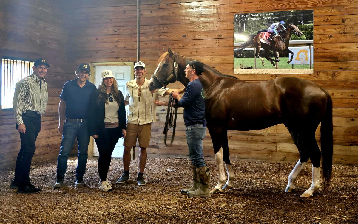 Last year, some of Book'em Danno's owners visited Bucchero before Danno took down the Gr 1 Woody Stephens. This year, they did the same before the Gr 1 Forego and got to see Dad standing proudly beneath a photo of his top son winning last years Grade 1! Good luck to Danno today!