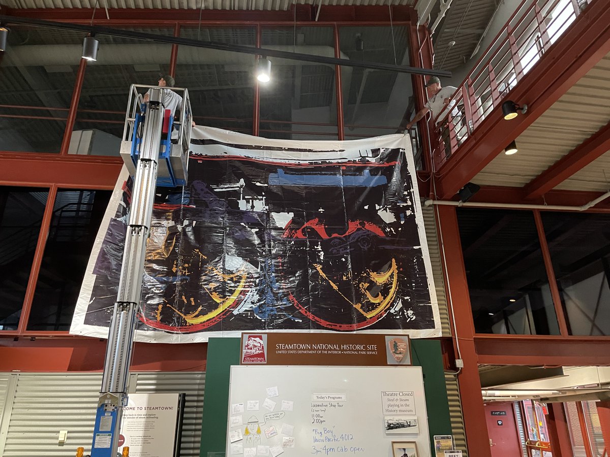steamtownnhs's tweet photo. Railfest planning is full steam ahead! This week we hung “Engine #6039,” a striking linocut and silkscreen print by artist Mark Ciocca, inspired by our very own Grand Trunk Western No. 6039, featured Railfest locomotive celebrating its 100th year. #Railfest https://t.co/3usFDOyRkP