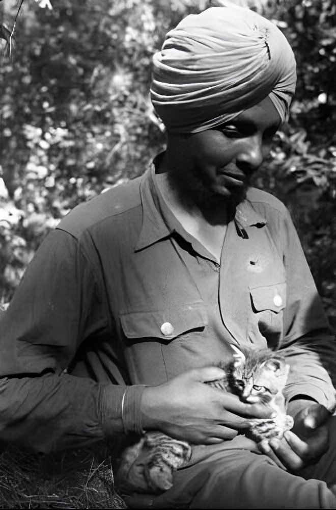 A Member of the Legion Freies Indien with his cat 
Netherlands, 1943