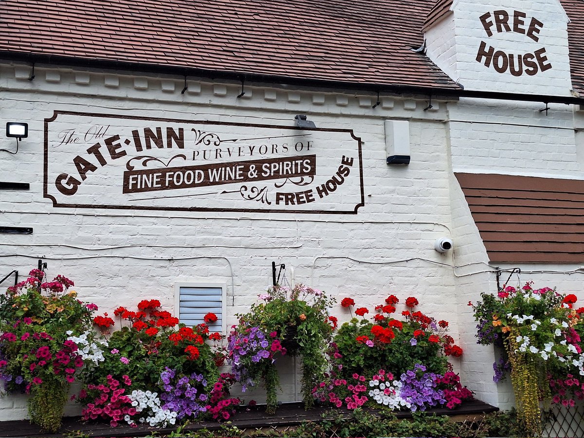 While we were enjoying a drink at our local "The Old Gate" in Heathton today, we noticed that this charming 17th-century pub has been beautifully enhanced by its new retro signage that adds a nostalgic touch. The stunning hanging baskets are beautiful with vibrant flowers, which