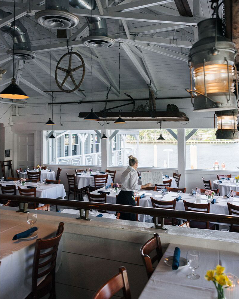 It's a bit rainy today on the waterway, but still nice to be dining inside with excellent seafood, service and views! Our waterfront tables are set for a perfect evening! Photo by Scott Wild Photography for the Matador Network.