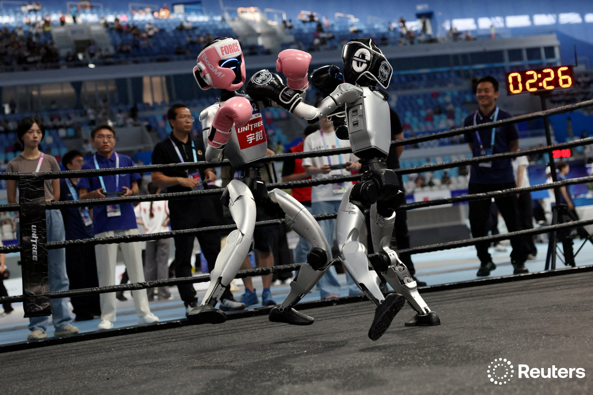 Reuters Pictures on X: "Humanoid robots compete in a kickboxing ...