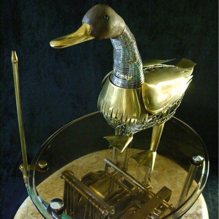 RealPreCinema's tweet photo. Jacques de Vaucanson made other automata; the Tambourine Player and the most famous being a duck that defecated.
But unlike The Flute Player, the duck was far less popular due to what it did vs. the playing of music.
The de Vaucanson duck top images, showing the internal mechanism, from a publication from the mid-1800s.
Bottom right a replica of Jacques de Vaucanson’s digesting duck automaton, from the Museum of Automata, Grenoble, France.
The original apparatus met its demise in a fire in 1879.