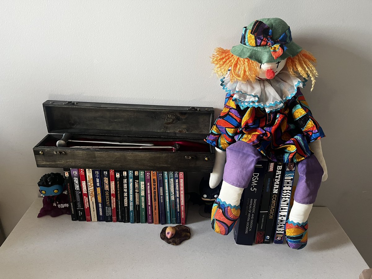 Chat how do we feel about the lobotomy tools on a shelf of Star Trek books next to my vintage clown plush set up in my dorm?
