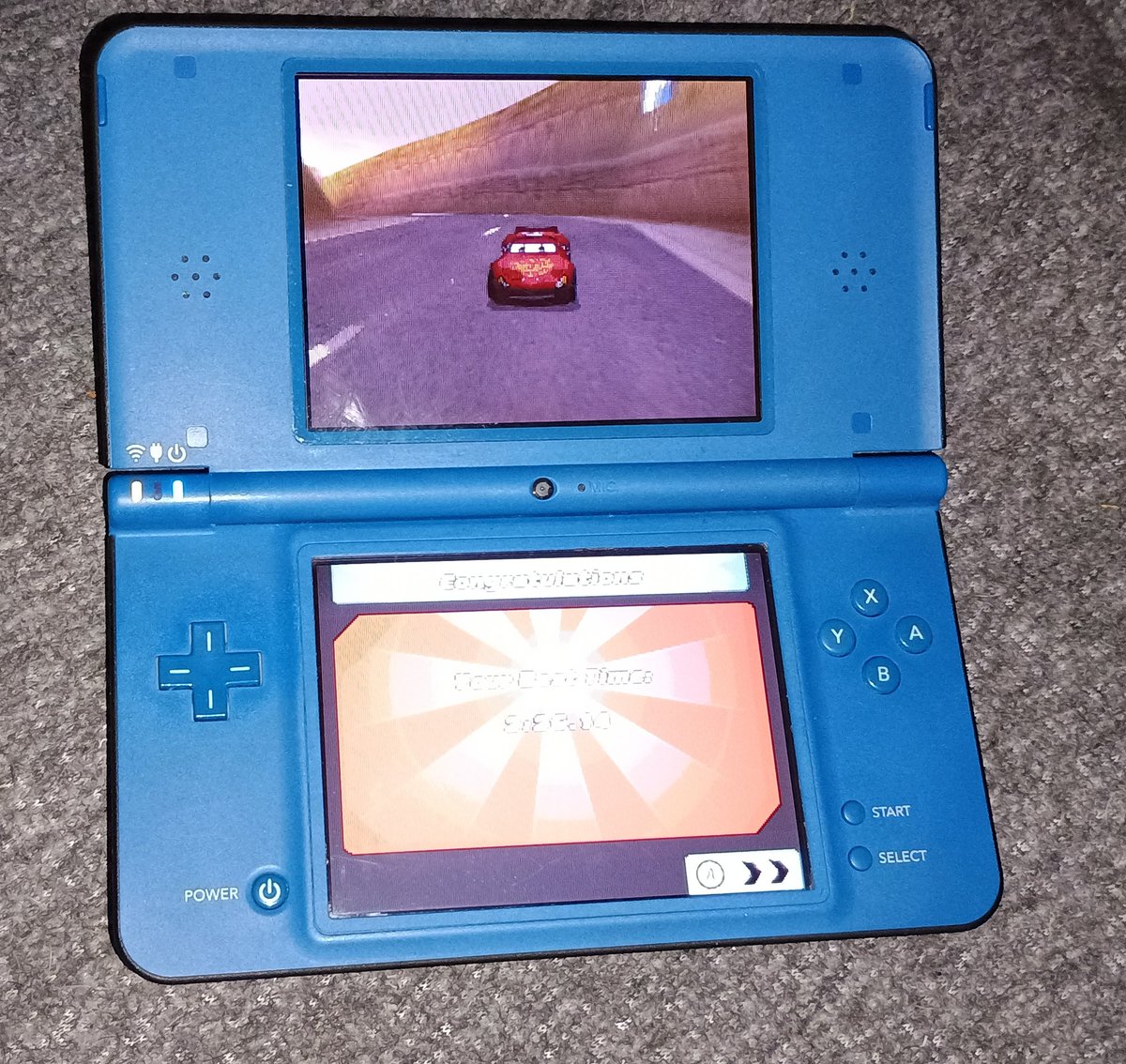 I picked up a DSI XL! Playing Cars Race o Rama right now and it looks great! I've never had a DSI XL, I just had a regular one growing up, but the screen on this is pretty great!