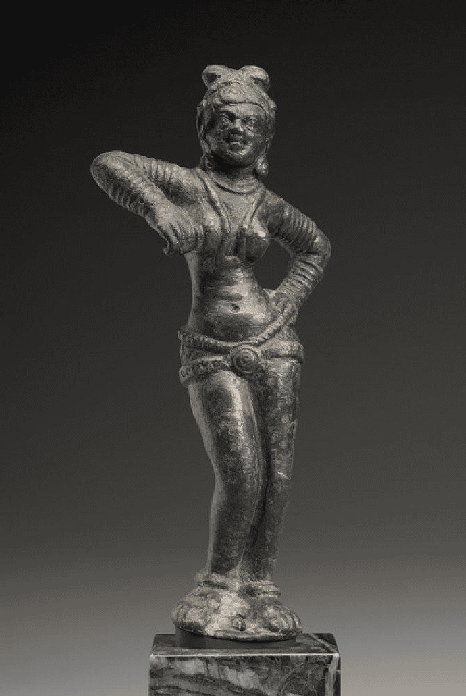 The so-called Dancing Girl statue found at Mohenjo Daro from the Harappan period (~2000 BCE) is almost identical to this 2nd cent. BCE statue of a Yakshi found at Mathura.

Why would you not assume that the Harappan Dancing Girl depicts a Yakshi as well?