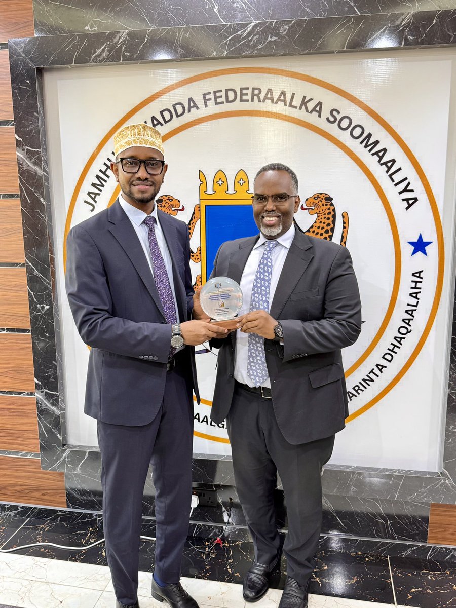 We were honored to welcome the award our Minister, <a href="/HonBeenebeene/">Hon. Mohamud Beenebeene</a>, received from the Prime Minister HE <a href="/HamzaAbdiBarre/">Hamza Abdi Barre</a> to the <a href="/MoPIED_Somalia/">MoPIED</a>. A proud moment for our team to hold this recognition together and celebrate our collective efforts that made it possible.