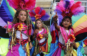 caribbeannewsuk's tweet photo. #LONDON: The Notting Hill Carnival began early on Sunday - children's day - with the J’ouvert celebration where people covered each other in paint, coloured powder and chocolate. https://t.co/FJ3Zb98zjw