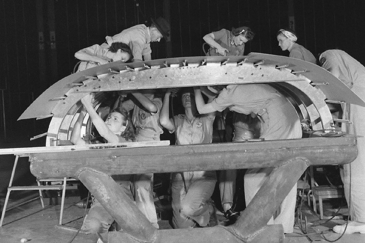 Rosie the riveters hard at work on a bomber at Fort Worth's Consolidated plant in 1942.  Sources differ regarding how many folks were employed by Consolidated (later Convair, then General Dynamics, now Lockheed Martin) during the war, but it was at least 32,000 and perhaps as