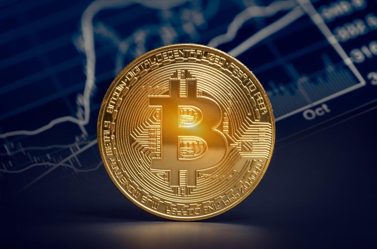 Golden Bitcoin coin on a financial chart background symbolizing strategic reserves