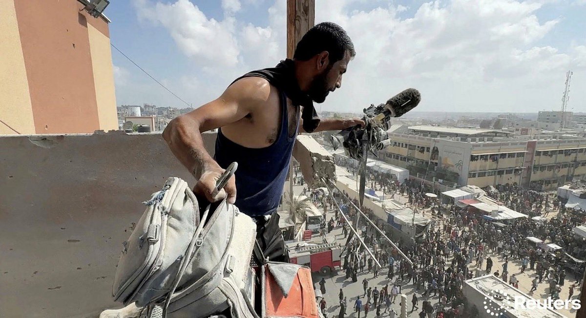 A man holds the equipment used by Palestinian cameraman Hussam al-Masri, who was a contractor for Reuters, at the site where he was killed along with other journalists and people in Israeli strikes on Nasser hospital, in Khan Younis, August 25, 2025. REUTERS/Hatem Khaled