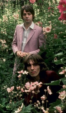 paul &amp; george in a flowerbed during the mad day out photoshoot - july 28, 1968