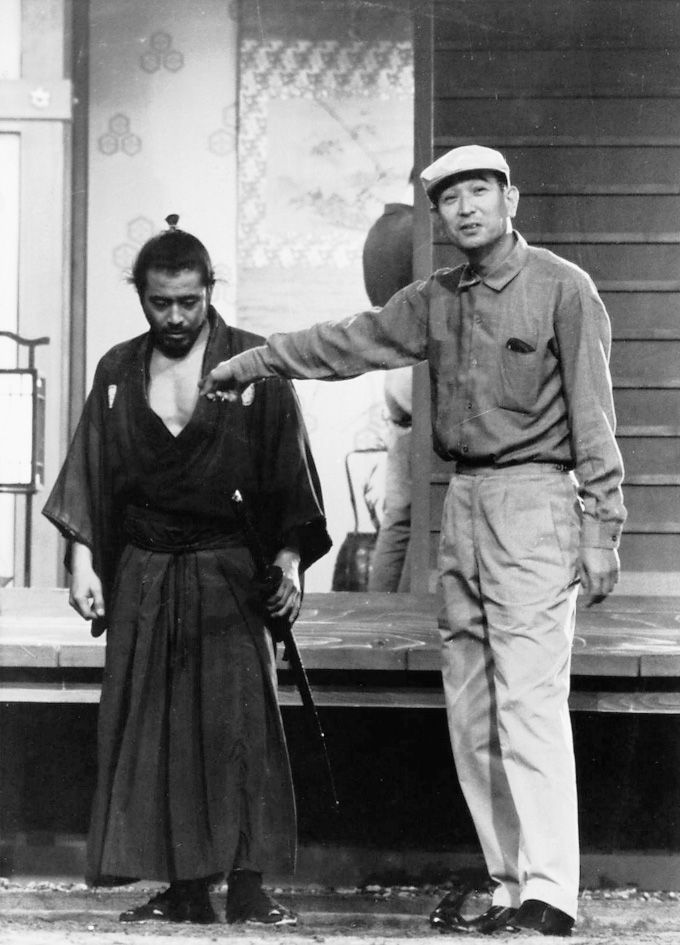 Toshiro Mifune &amp; Akira Kurosawa behind the scenes of 'Yojimbo' (1961).