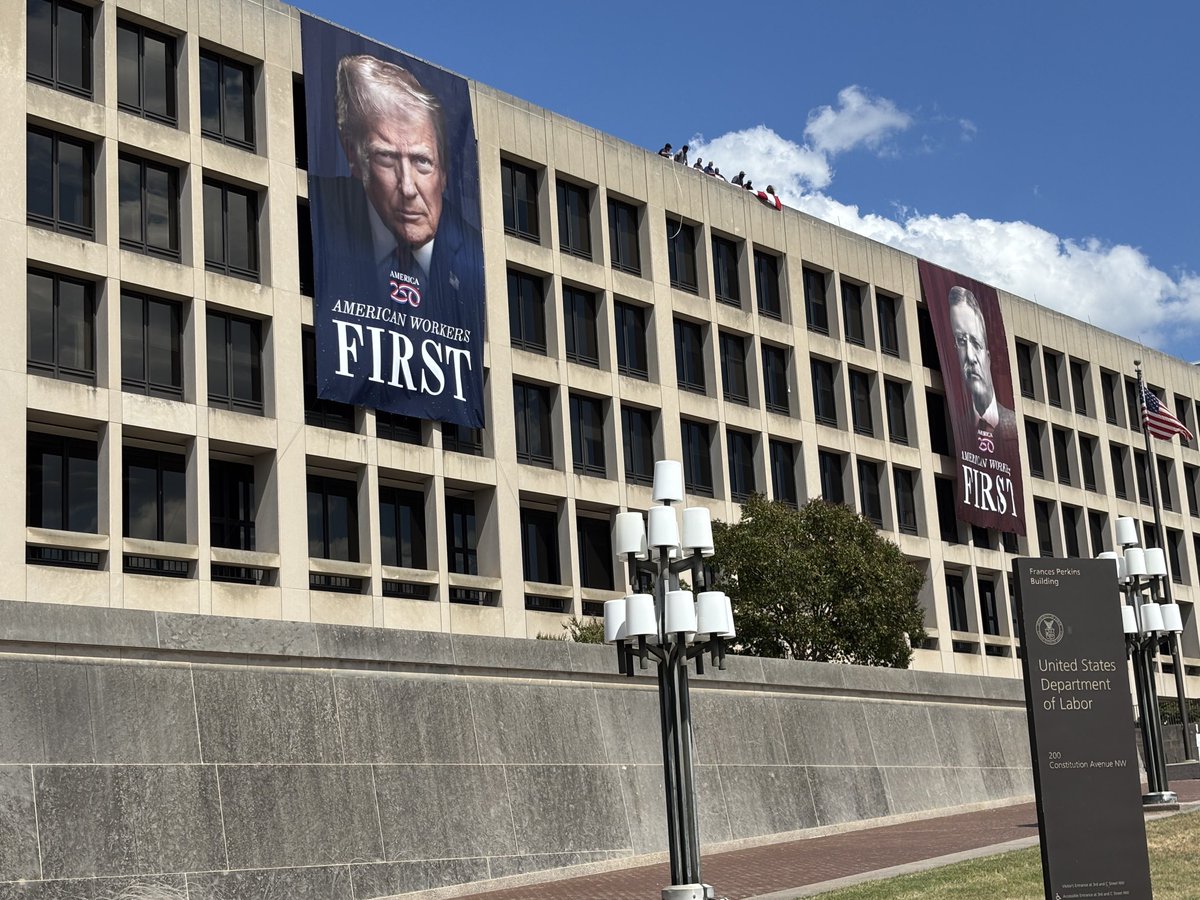 US Dept of Labor  Building today - three story poster honoring sitting president alongside Teddy Roosevelt