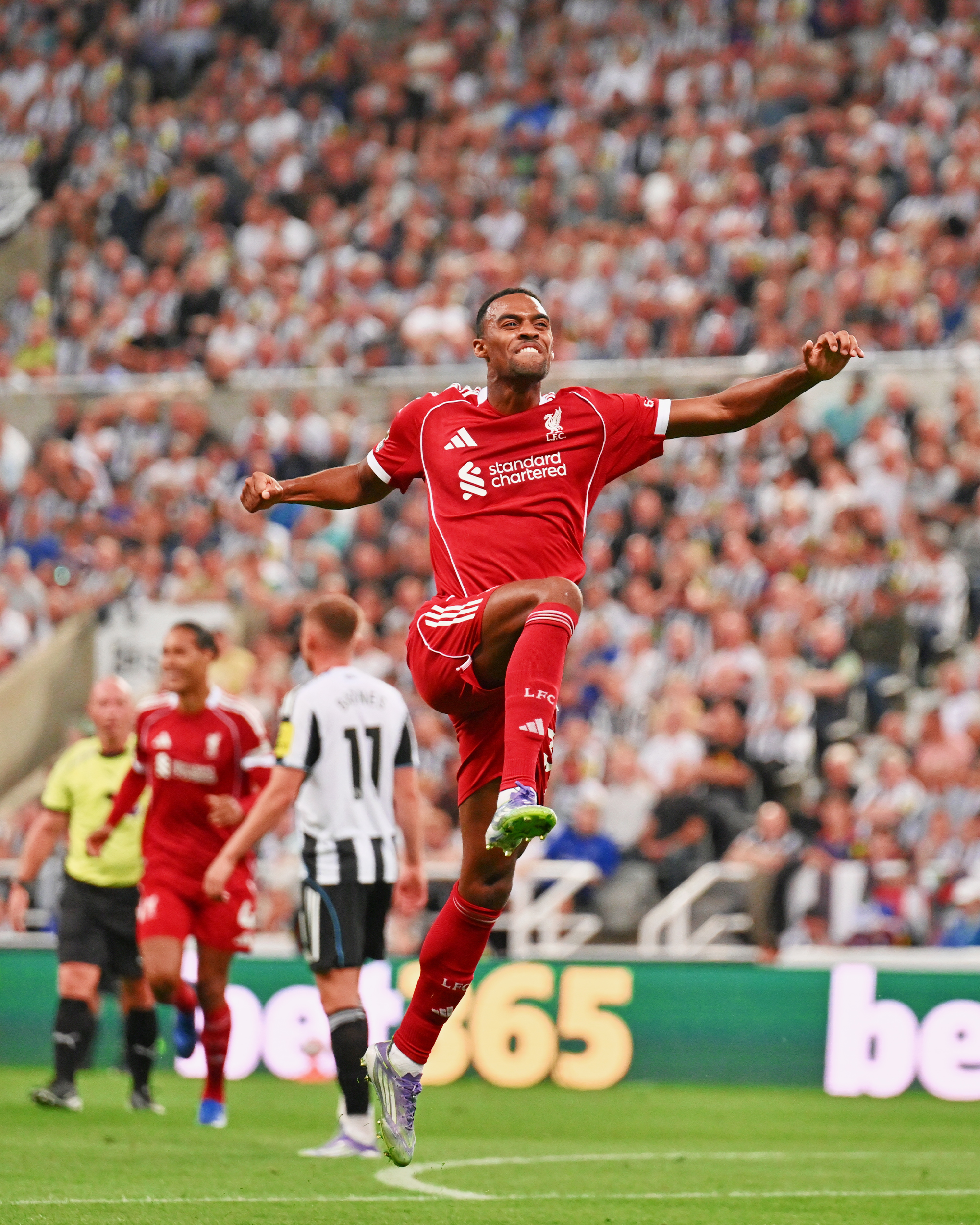 Photography of Ryan Gravenberch celebrating his goal against Newcastle.