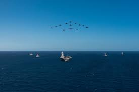 Over there, over there,
Send the word, send the word over there—
That the Yanks are coming, The Yanks are coming,