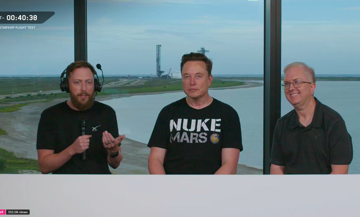 Elon Musk is wearing a T-shirt with the words 'Nuke Mars.'

The words on the T-shirt means detonating nuclear bombs over Mars’ poles to release heat, warm the planet, and potentially make it more habitable.