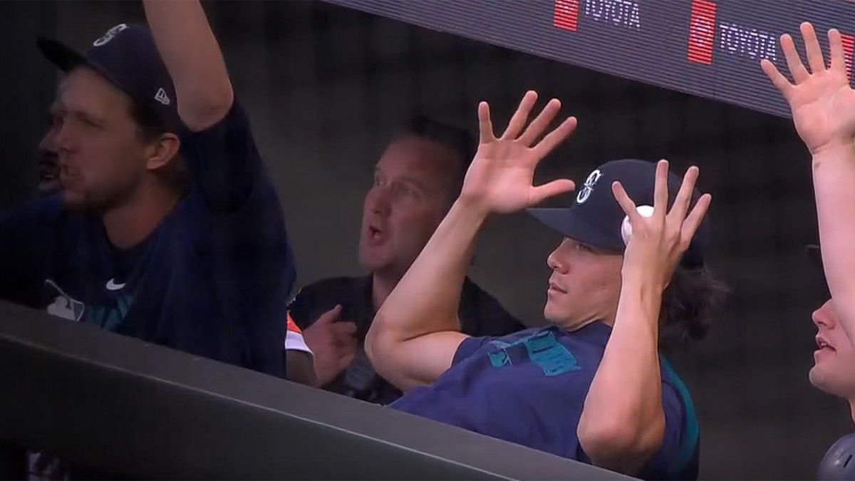 Bryan Woo, personifying everyone after Cal Raleigh's 50th reached the second deck.