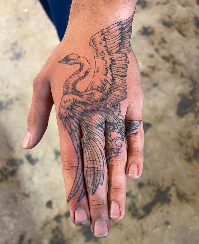 rogue's tweet photo. The art of hand tattoos https://t.co/2JEsbSWgY5