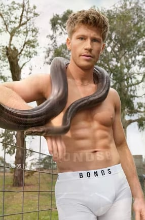 We all know Steve Irwan the crocodile hunter from TV &amp; Australia Zoo. Well after his death his young son Robert followed in his father's footsteps except advertising underwear. I do like the snake young Robert is showing off!  Hey neck level ladies eyes up!!