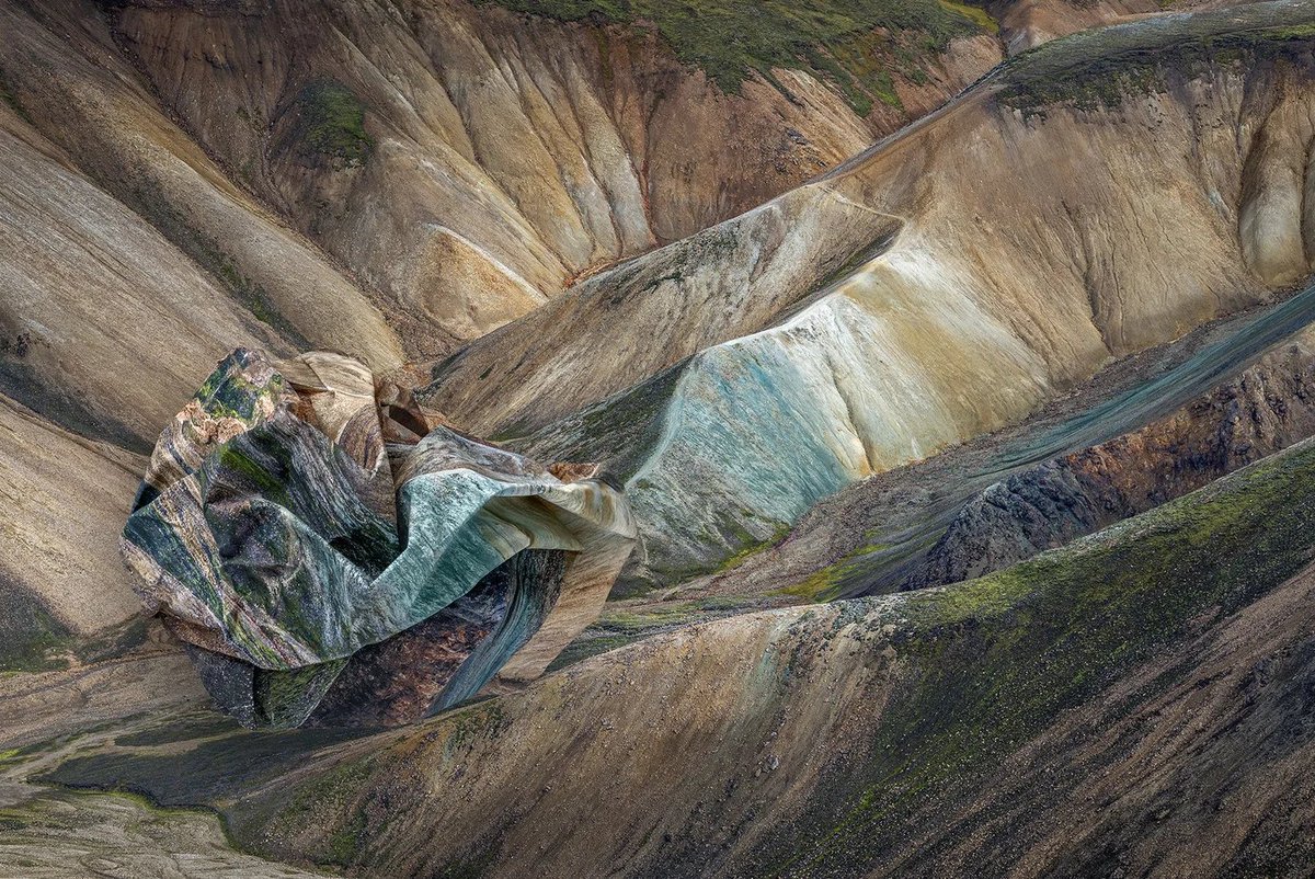 Ingrid Weyland takes photographs of landscapes, prints them, and then crumples the paper.

Her background in graphic design gave her the idea to treat prints as objects, by folding and reshaping them, she creates a unique style and shows how the environment itself can be scarred,