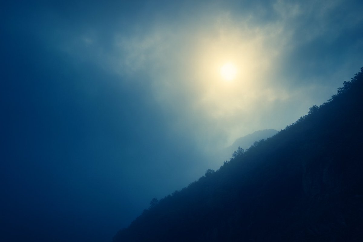 In mist’s embrace, the mountain lies still, and the sun, a dim dream, shines through fragile blue.  It is the darkest hour of night… just before the dawn awakens.
#1of1SZN
<a href="/mamaralic/">mamaralic</a> 

Starting bid: 30 xtz 

objkt.com/tokens/KT1GdGq…