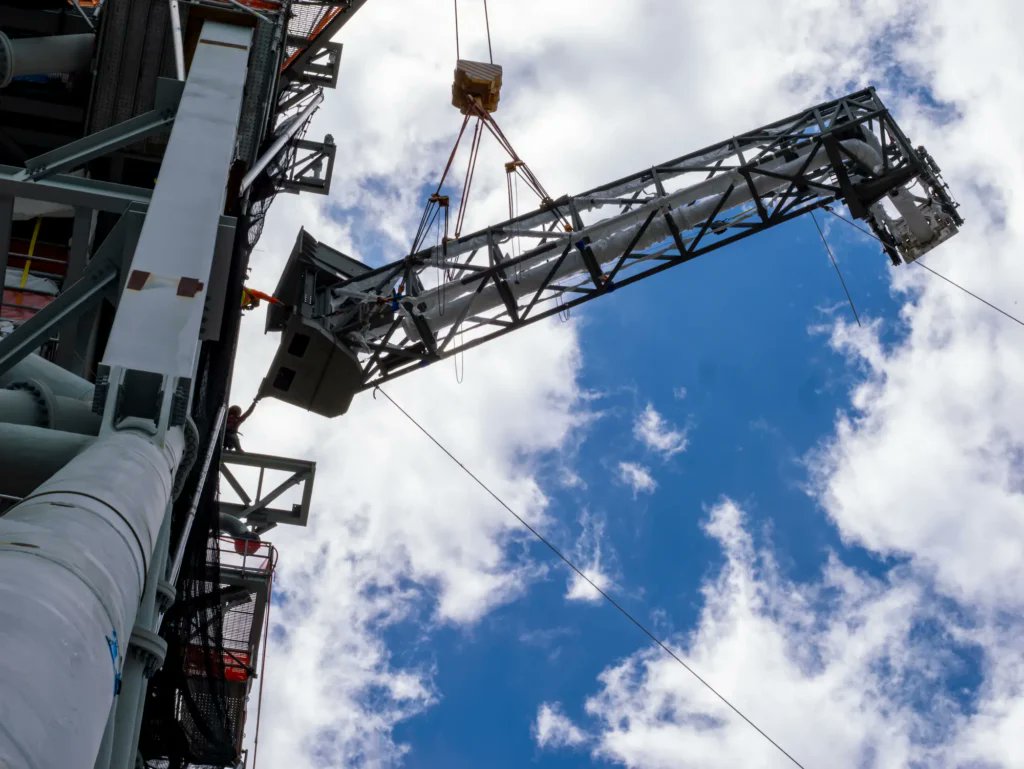 Bechtel has published some photos of the umbilical arms for Mobile  Launcher 2 now installed onto the tower.  The launcher is on track to be completed this year, allowing it to begin commissioning next year. It will move to LC-39B for the first time  shortly after Artemis II.