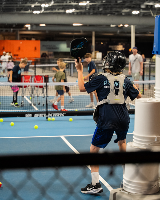 Power_PBC_'s tweet photo. Coach Clint’s secret training program: let the kids practice aim directly at him 🎯 

Works every time.

#PowerPickleball #SpokanePickleball https://t.co/XFCR0rtCp1