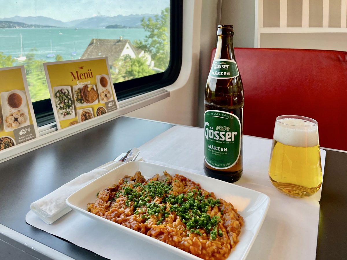 AndreasWiede's tweet photo. Hello from the #ÖBB 🇦🇹 #Railjet #DiningCar, where I enjoy a creamy, organic, risotto and a 🍺. 
#RailJetExpress #RJX services make an appearance at #Zurich🇨🇭HB every two hours. They stand out because of their red livery which appears particularly shiny in the afternoon sun. https://t.co/yuAJdjjI4L