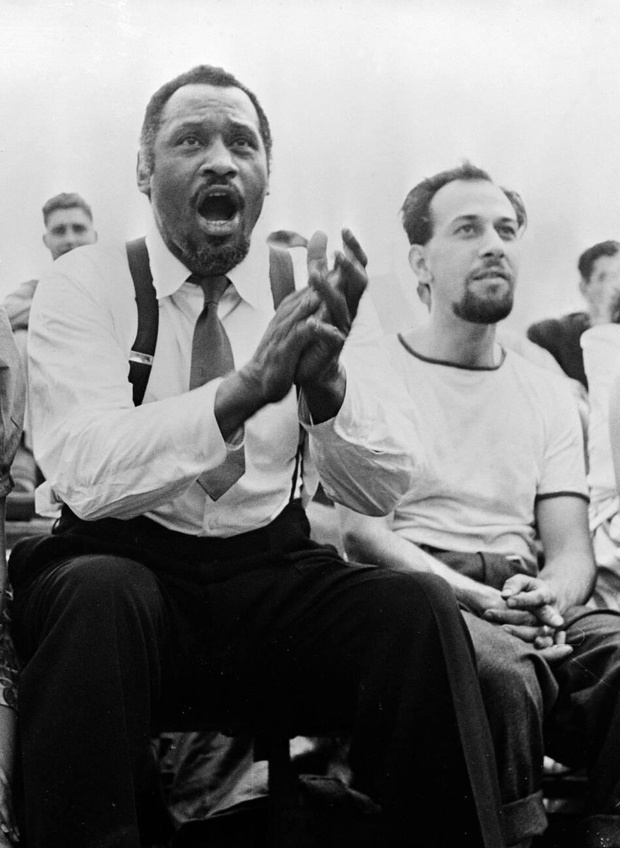 Paul Robeson and José Ferrer watching a softball game during a break from the Broadway production of Othello, 1943