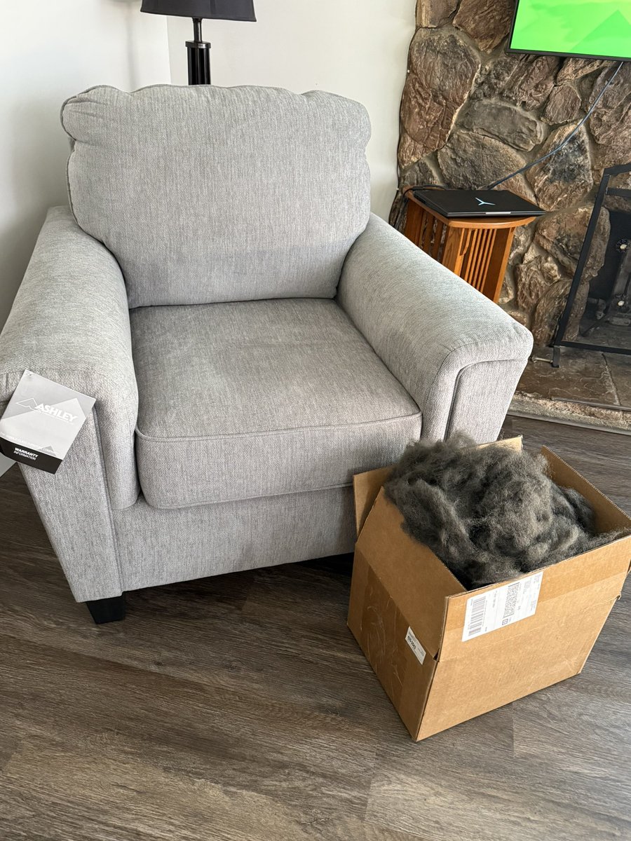 #ashleyfurniture you delivered a new chair to us last week. The top of the left arm is missing the stuffing. We called, customer support sent us this. A box of stuffing. What do we do with this? Is this real?
