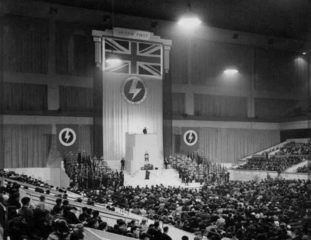 Privately educated far-right leader addresses fascists. And a photo of Oswald Mosley.