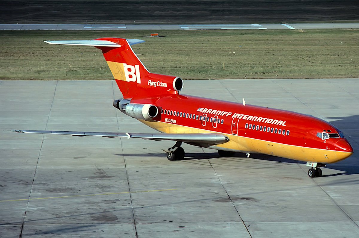 HOUSTON THANK YOU FOR FLYING BRANIFF INTERNATIONAL - Braniff International Boeing 727-185C Trijet registered as N308BN is taxiing at Houston Intercontinental Airport on December 1, 1978. Braniff High Wide and Handsome 727 Braniff Place is painted in the 1971 Glenn Geddis/Harper