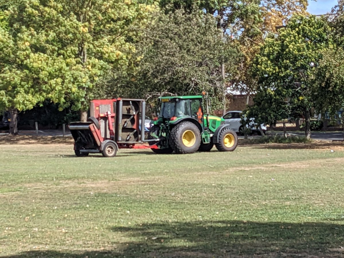 Forget mowers - grass cutting is a serious business on Cricket Green