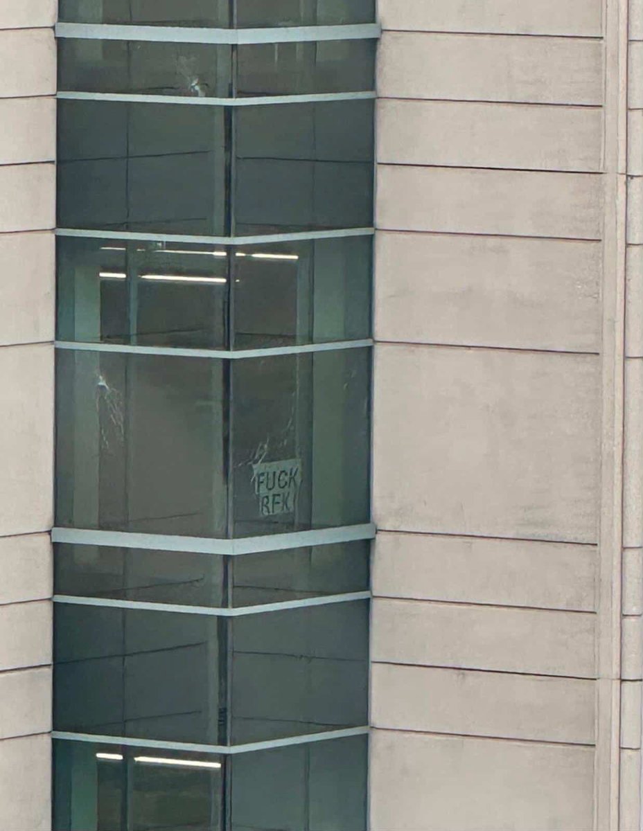 CDC building with bullet holes and a message for RFK Jr.