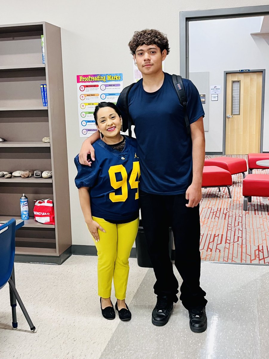 tiny_teach05's tweet image. There’s no greater honor than wearing the jerseys of my past students on game days. 💙💛 Every name, every number carries a story, a memory, and a bond that goes far beyond the classroom.
Repping them under the Friday night lights reminds me why I love what I do. 🏈🍏🤓
