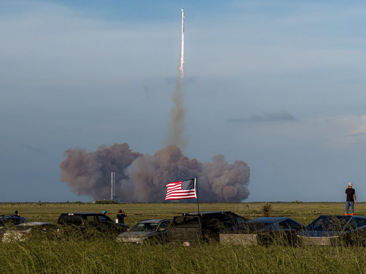 Telephoto lens compression, demonstrated during Starship Flight 10

Using a long lens and stepping back from a foreground element allows you to juxtapose two different subjects in creative ways.

800mm photo and ~120mm photos: