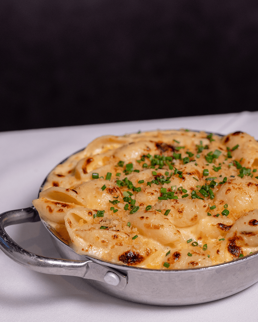 Decadent and savory—our Shells + Cheese are baked with Boursin and 9-month aged sharp white cheddar, and topped with garlic breadcrumbs for rich, layered flavor.

#domsteak #steakhouse