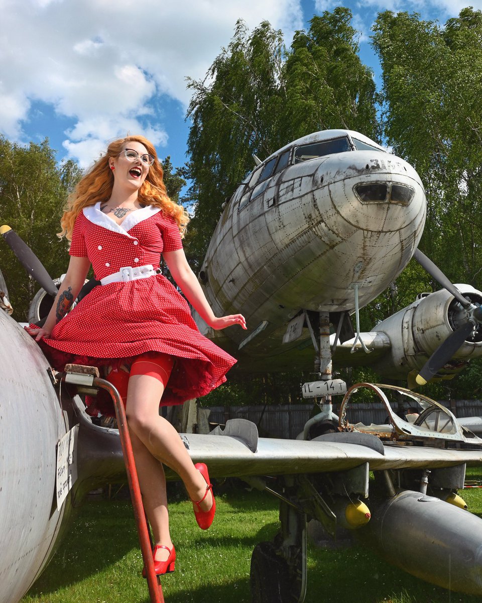 Niki_Foxmutt's tweet photo. A touch of retro elegance by the wings of history βοΈβ€οΈ I just love when vintage style meets the charm of old aircraft. Do we match? π
#ootd #VintageStyle #classy #PinUpLook #aviation https://t.co/15J9KVTJhI
