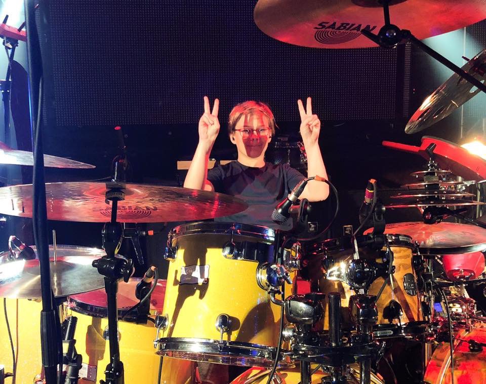 Scavron's tweet photo. @RevDaddyLove @WillCalhounDrum @vurnt22 8 yrs ago you let my son sit at yr drums pre-show. He wasn’t yet serious w/music. Today he is a sophomore music major on drums in college! Partly inspired by that Night! And Cory you said next time we see you, you better have practiced! :) https://t.co/9nI51wOyK3