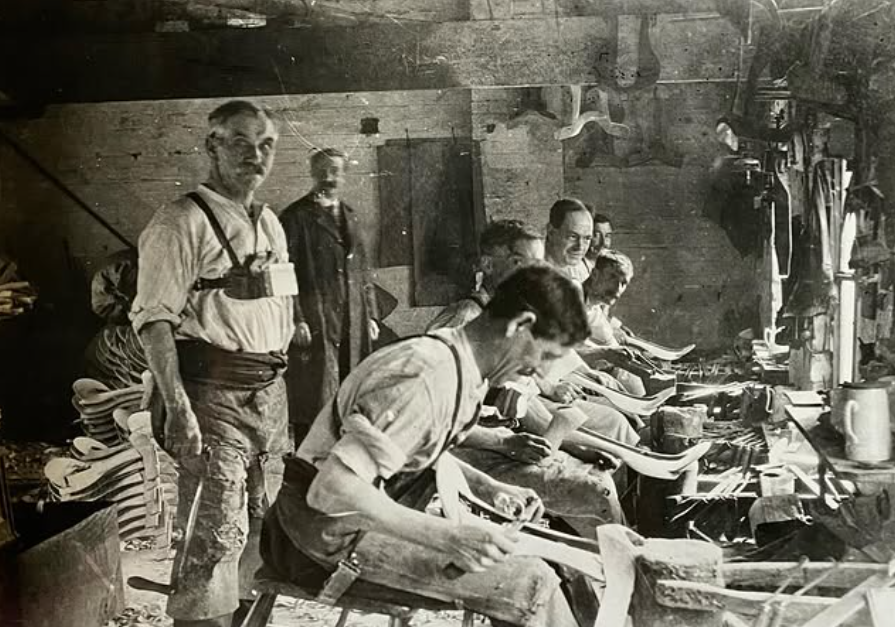 Here, craftsmen at Thomas Lote Woollatt Ltd of Birmingham St (c.1900) make saddle-trees (the skeleton of a saddle) They use drawshaves to shape it. The breast plates they wear hold the tree in place whilst they work.

We hope they did a finger count at the end of the day...👀
